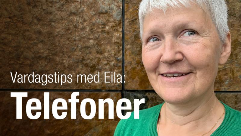 Eila Lundin har kort grått hår och en grön tröja. Hon står framför en brun vägg i sten.
